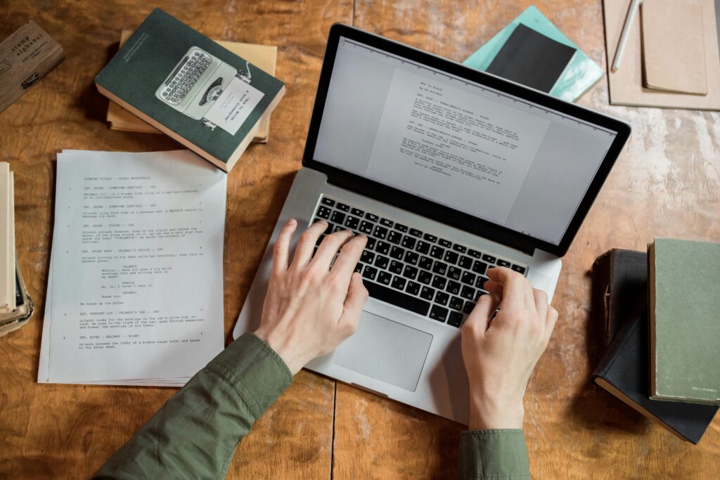 Image of a man typing on a laptop