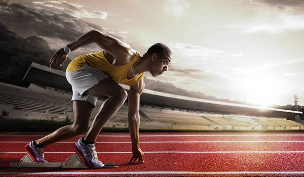 A person on a track field symbolizing ready to success